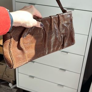 Brown leather clutch